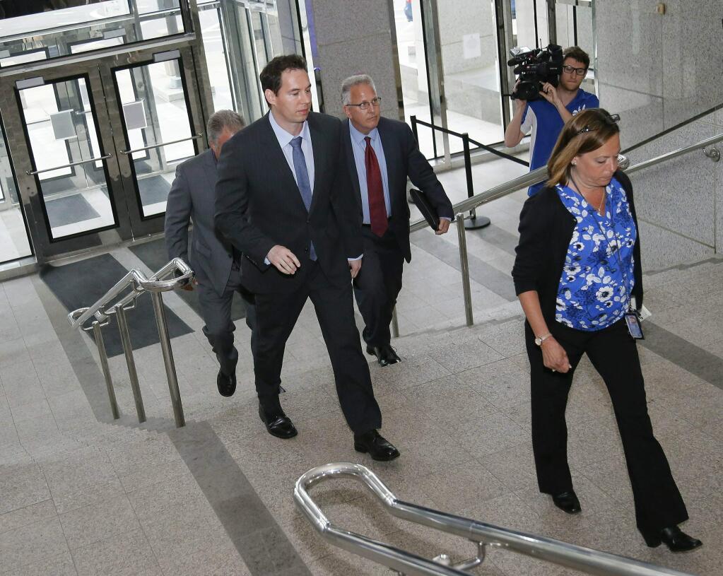 Former Mount Carmel Dr. William Husel arrives at the downtown Columbus Division of Police headquarters, where he was charged with 25 counts of murder before being transported to the Franklin County Jail on Wednesday, June 5, 2019. Husel is accused of ordering excessive doses of painkillers for 35 patients over a four-year period. (Adam Cairns/The Columbus Dispatch via AP)