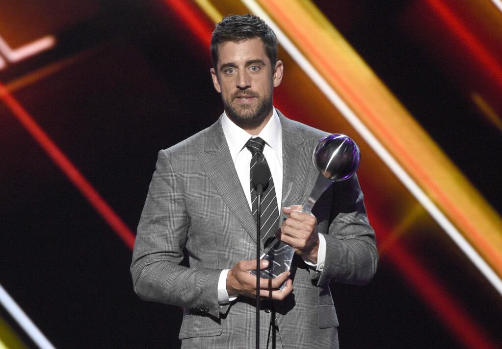 NFL football player Aaron Rodgers, of the Green Bay Packers, accepts the award for best play at the ESPYS at the Microsoft Theater on Wednesday, July 12, 2017, in Los Angeles. (Photo by Chris Pizzello/Invision/AP)