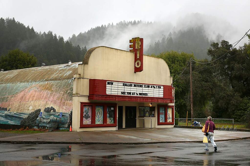 Zelda Michaels walks up to the Rio Theater in Monte Rio on Sunday, February 2, 2014. The theater was recently sold and will have a change in ownership. (Conner Jay/The Press Democrat)