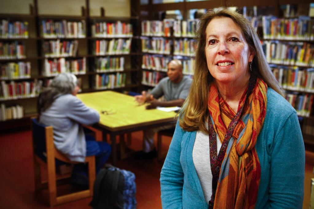 Petaluma, CA, USA. Friday, February 10, 2017._Barbara Pieper, disability benefits advocate for COTS, works with the community to inform them about benefits available to them, a step towards finding financial stability. She holds office hours at the library. (CRISSY PASCUAL/ARGUS COURIER STAFF)