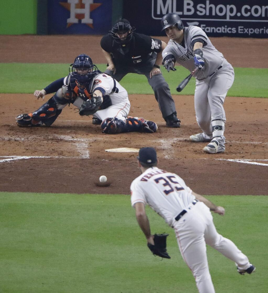 New York Yankees' Gary Sanchez hits a ground ball back to Houston Astros starting pitcher Justin Verlander during the fourth inning of Game 6 of baseball's American League Championship Series Friday, Oct. 20, 2017, in Houston. (AP Photo/Charlie Riedel)
