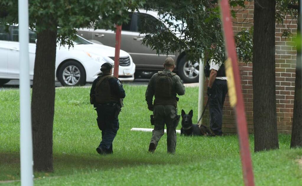 Authorities respond to a shooting in Harford County, Md., Thursday, Sept. 20, 2018. Authorities say multiple people have been shot in northeast Maryland in what the FBI is describing as an 'active shooter situation.' (Jerry Jackson /The Baltimore Sun via AP)