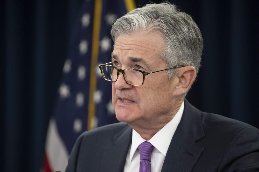 Federal Reserve Chairman Jerome Powell pauses as he considers a reporter's question, Wednesday, Jan. 30, 2019, in Washington. The Federal Reserve is keeping its key interest rate unchanged and promising to be 'patient.' It is signaling it could leave rates alone in coming months given muted inflation. (AP Photo/Alex Brandon)