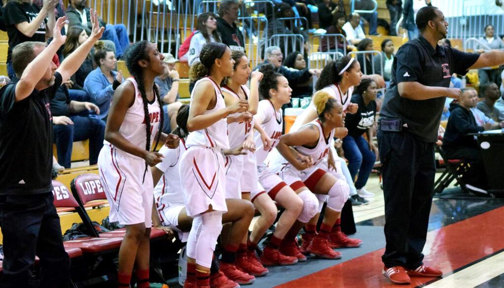 Coaches and players react to the final seconds of a close game as the Lady Lopes pulled off another win in the fourth quarter of the second round of CIF State tournament play in Lancaster , Saturday night, between Antelope Valley High School and Notre Dame Academy. Evelyn Kristo/Valley Press Mar 12,2016