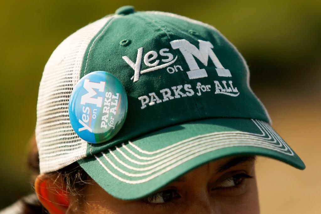 Maria Anguiano wears her Yes on M hat and button before going out to canvas the neighborhood around Andy's Unity Park for support of Measure M, in Santa Rosa, California, on Friday, October 26, 2018. The Measure M - Parks for All campaign supports a sales tax increase to fund city and county parks. (Alvin Jornada / The Press Democrat)