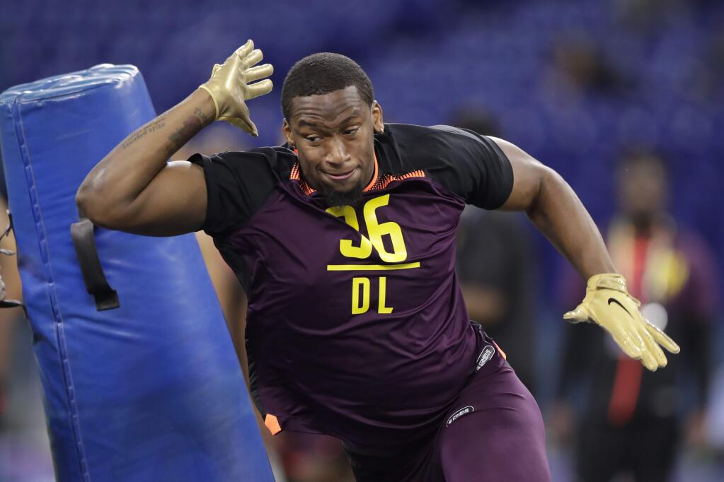 FILE - In this March 3, 2019, file photo, Clemson defensive lineman Clelin Ferrell runs a drill at the NFL football scouting combine, in Indianapolis. Ferrell is a possible pick in the 2019 NFL Draft. (AP Photo/Michael Conroy, File)
