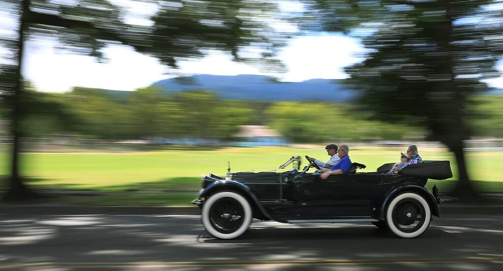 After rallying with other Pierce Arrow drivers at Jack London State Park in Glen Ellen, Thursday, July 12, 2018, a Pierce Arrow is driven along Arnold Drive. The cars were widely accepted as luxury vehicles in the early twentieth century and will be on display to the public tomorrow in Rohnert Park. (Kent Porter / The Press Democrat) 2018