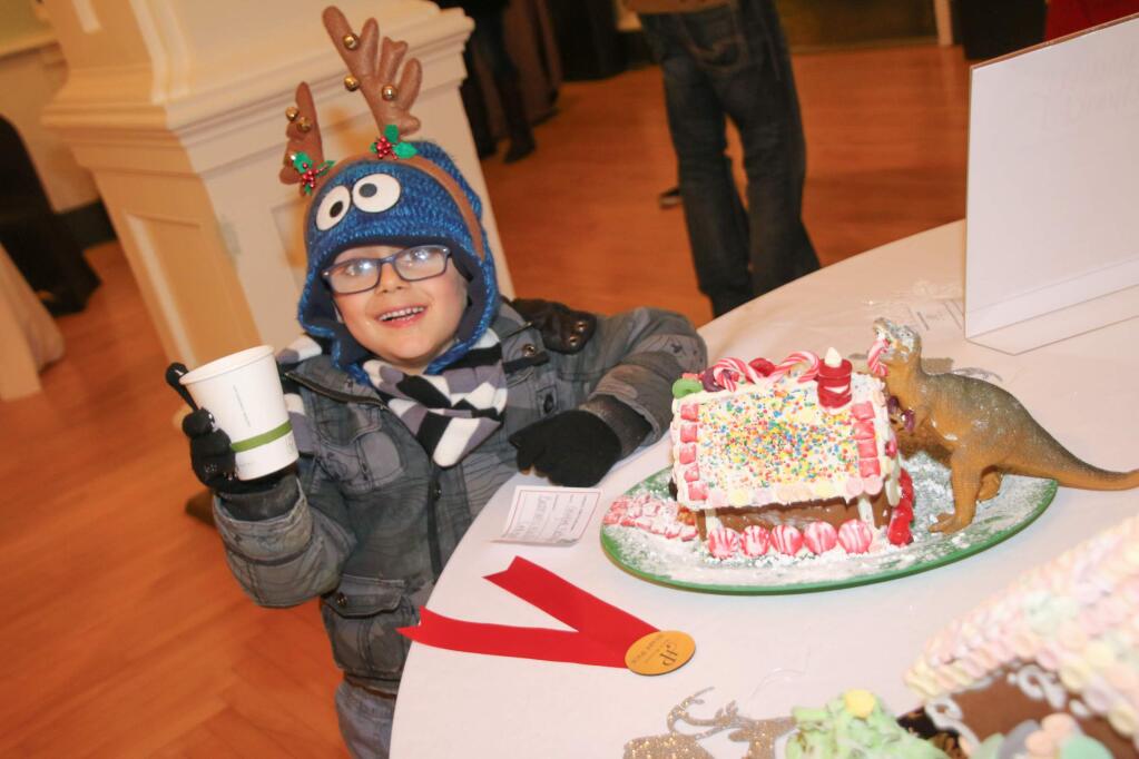Grayson Battaglino stands behind his work entitled Battman's Winter Lodging. He won staff pick at Hotel Petaluma's First Annual Gingerbread House Showcase and Competition. Photo by Victoria Webb for The Argus-Courier