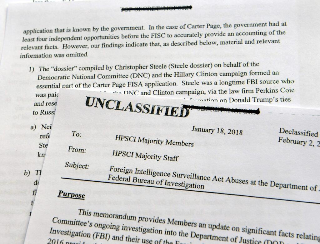 A intelligence memo is photographed in Washington, Friday, Feb. 2, 2018. After President Donald Trump declassified the memo, the Republican-led House Intelligence Committee released the memo based on classified information that alleges the FBI abused U.S. government surveillance powers in its investigation into Russian election interference.(AP Photo/Susan Walsh)