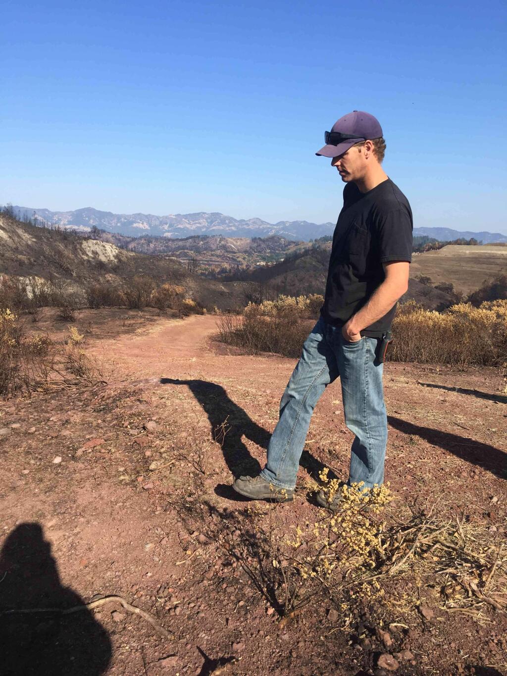 Drew Loganbill surveys an area that burned during the Northern California wildfires.