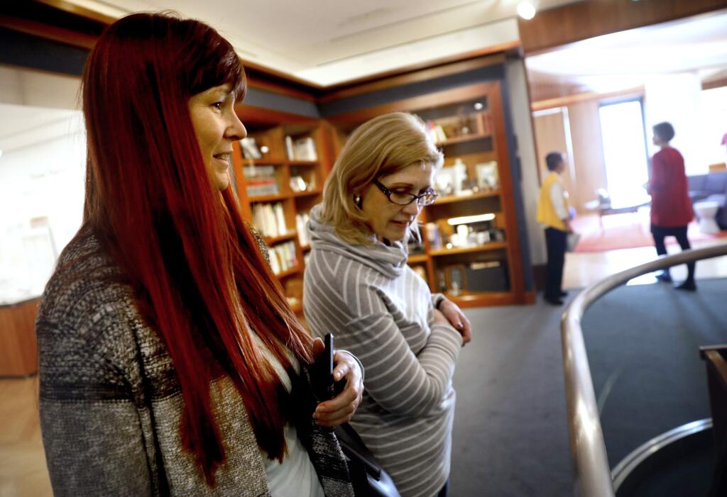 Redhead Felecia Hobbs and her sister Sandy Headrick visit the Charles M. Schulz Museum in Santa Rosa, on Sunday, February 12, 2017. (BETH SCHLANKER/ The Press Democrat)