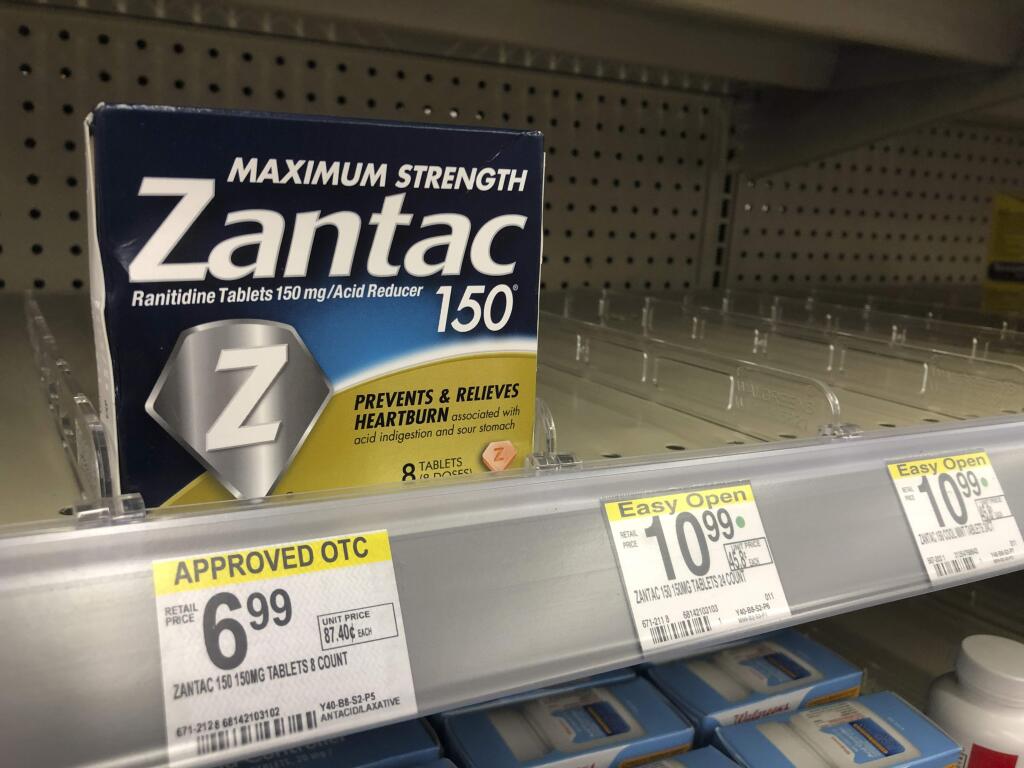 A box of Maximum Strength Zantac tablets is shown at a pharmacy, Monday, Sept. 30, 2019, in Miami Beach, Fla. CVS has halted sales of the popular heartburn treatment and the store generic version after warnings by U.S. health regulators. (AP Photo/Wilfredo Lee)