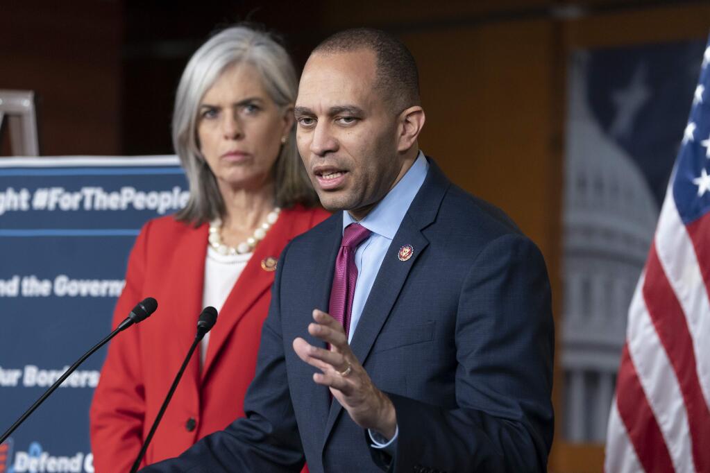 Rep. Hakeem Jeffries, D-N.Y., the Democratic Caucus chair, joined at left by Rep. Katherine M. Clark, D-Mass., left, Caucus vice chair, speaks with reporters at the Capitol in Washington, Wednesday, Feb. 13, 2019. Jeffries indicated that House Democrats would support the bipartisan border security compromise needed to avert another government shutdown. (AP Photo/J. Scott Applewhite)