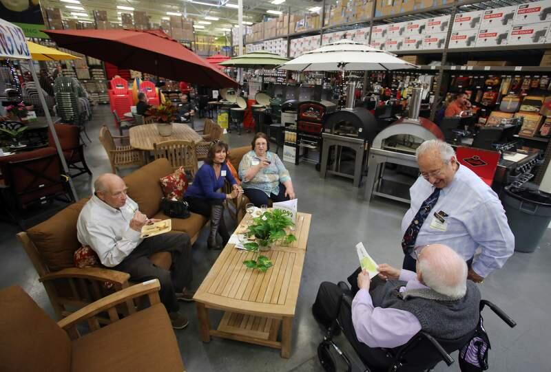 Harry Friedman, right, chats with his brother-in-law Sydney Perlman during a private party held at the new Friedman's Home Improvement store in Petaluma Wednesday, April 30, 2014. (Crista Jeremiason / The Press Democrat)