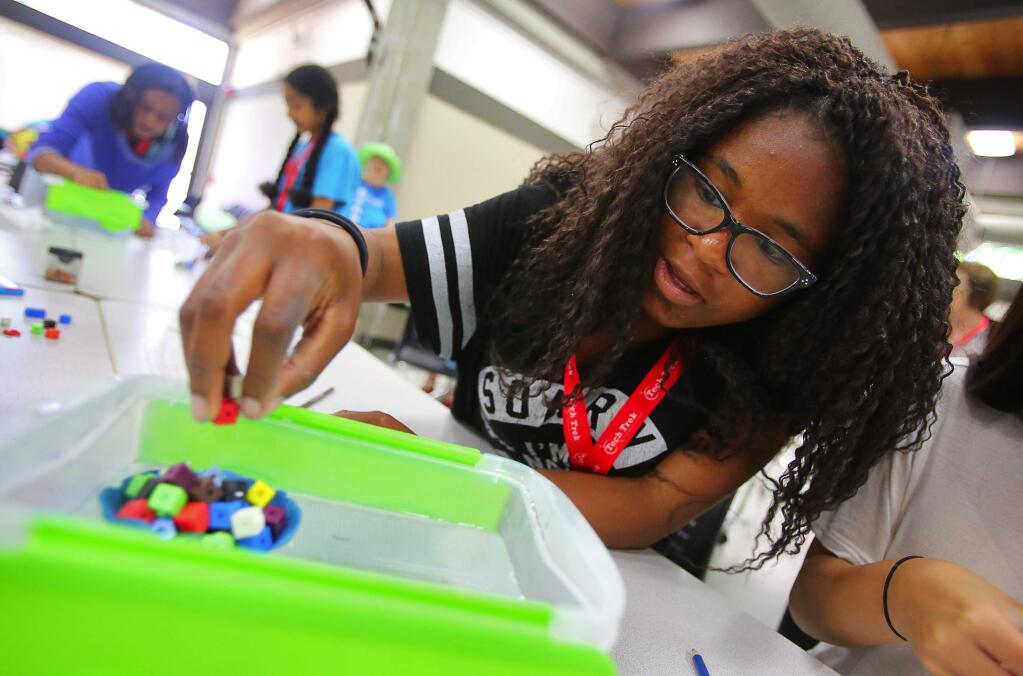 Amaya Watson carefully places blocks into a clay boat that she made during the Tech Trek camp, on the Sonoma State University campus in Rohnert Park on Thursday, June 22, 2017. The Tech Trek camp, by the American Association of University Women, provides a week-long hands-on experience for girls in science, technology engineering, and math.(Christopher Chung/ The Press Democrat)