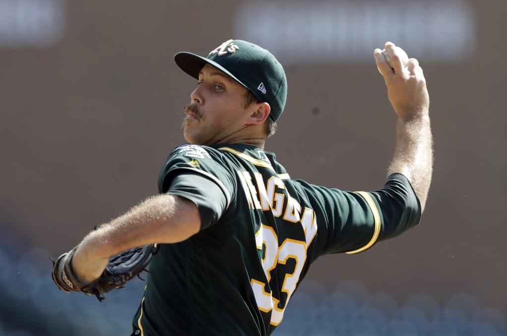 Oakland Athletics starting pitcher Daniel Mengden throws during the first inning of a baseball game against the Detroit Tigers, Wednesday, Sept. 20, 2017, in Detroit. (AP Photo/Carlos Osorio)