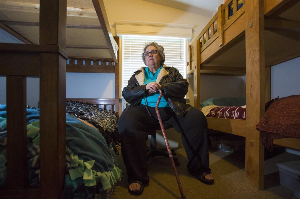 Cathy King, executive director of the Haven, in one of the dorm rooms at the shelter. (Photo by Robbi Pengelly/Index-Tribune)