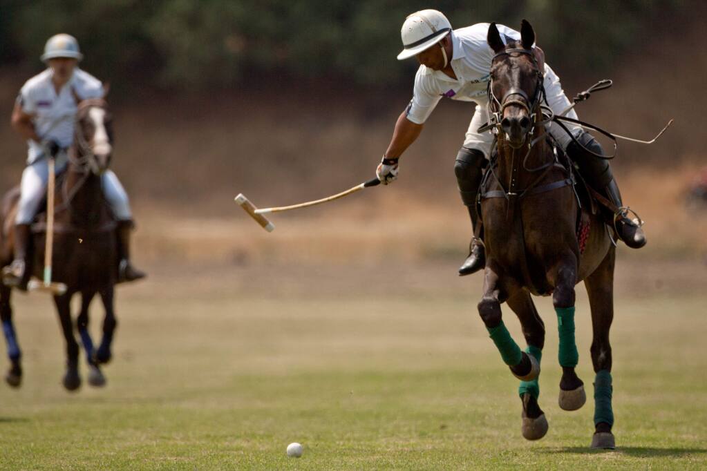 Alberto Gonzales of Team Argentina makes a shot on goal during a match against Team USA in the International Polo Classic at the Cerro Pampa Polo Fields in Petaluma, California, on August 3, 2014. (Alvin Jornada / For The Press Democrat)