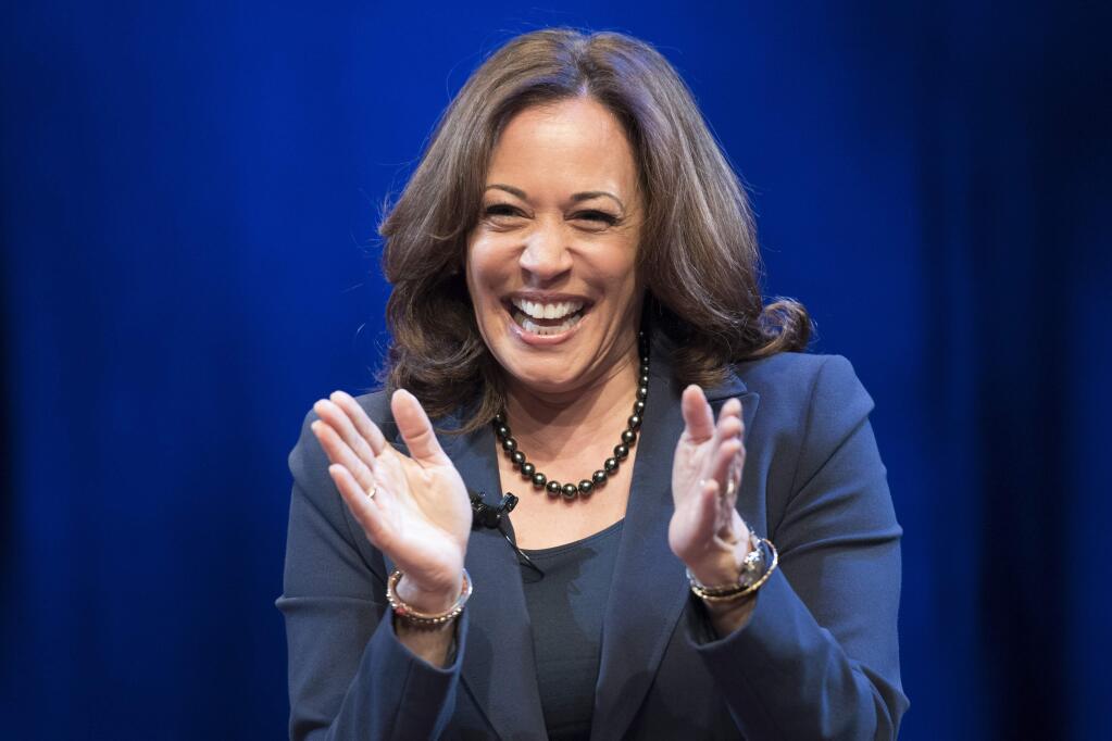 In this Jan. 9, 2019 photo, Sen. Kamala Harris, D-Calif., greets the audience at George Washington University in Washington, during an event kicking off her book tour. Harris, a first-term senator and former California attorney general known for her rigorous questioning of President Donald Trump's nominees, entered the Democratic presidential race on Monday. (AP Photo/Sait Serkan Gurbuz)