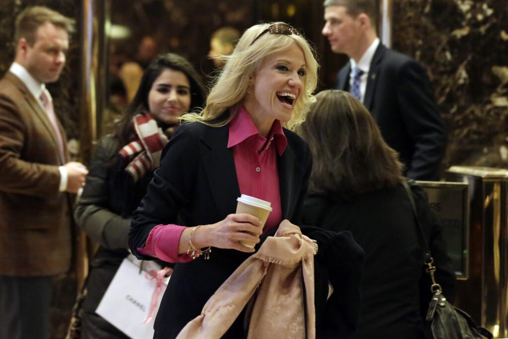 Kellyanne Conway, President-elect Donald Trump's campaign manager, walks through the Trump Tower lobby in New York, Friday, Dec. 16, 2016. (AP Photo/Richard Drew)