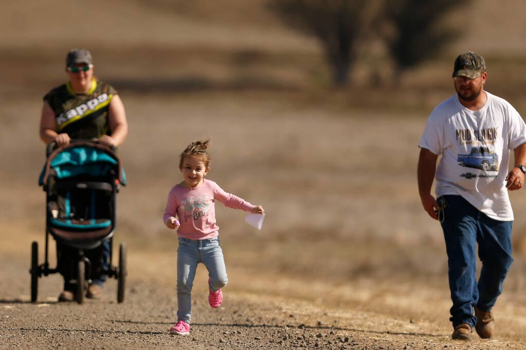Alayna Wood, 4, runs ahead of her parents Doug and Becky, along the Causeway Trail at Tolay Lake Regional Park in Petaluma, California, on Saturday, October 27, 2018. (Alvin Jornada / The Press Democrat)