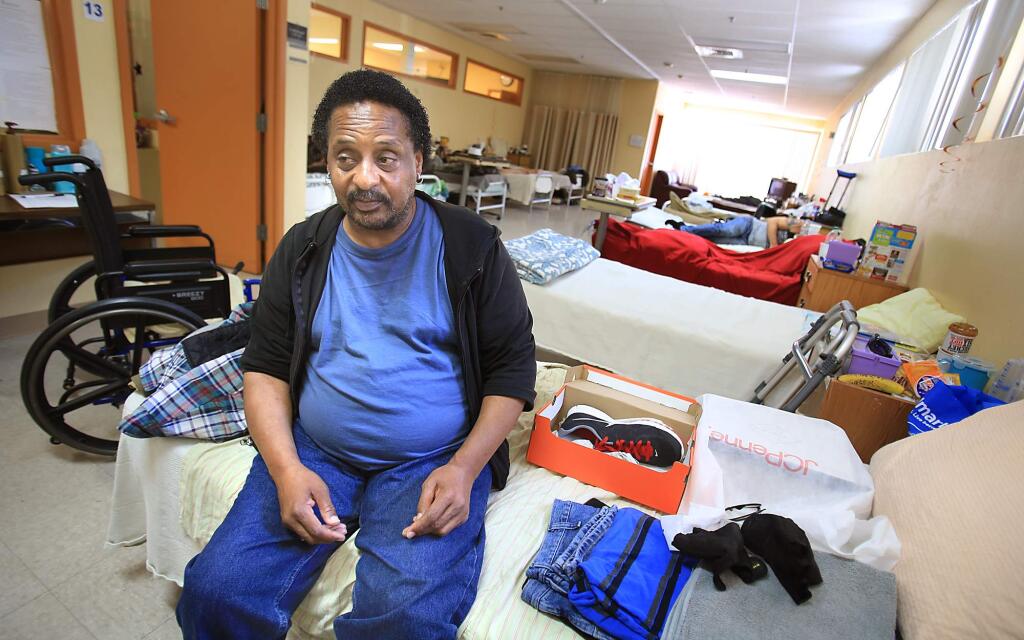 Brian Barnard, 54, is getting his feet back under him, using Catholic Charities' Project Nightingale as a safe place to rehabilitate from medical issues, Thursday Aug. 13, 2015 in Santa Rosa. Barnard is considered a fall risk, so must use a wheelchair and a walker to exercise. (Kent Porter / Press Democrat)