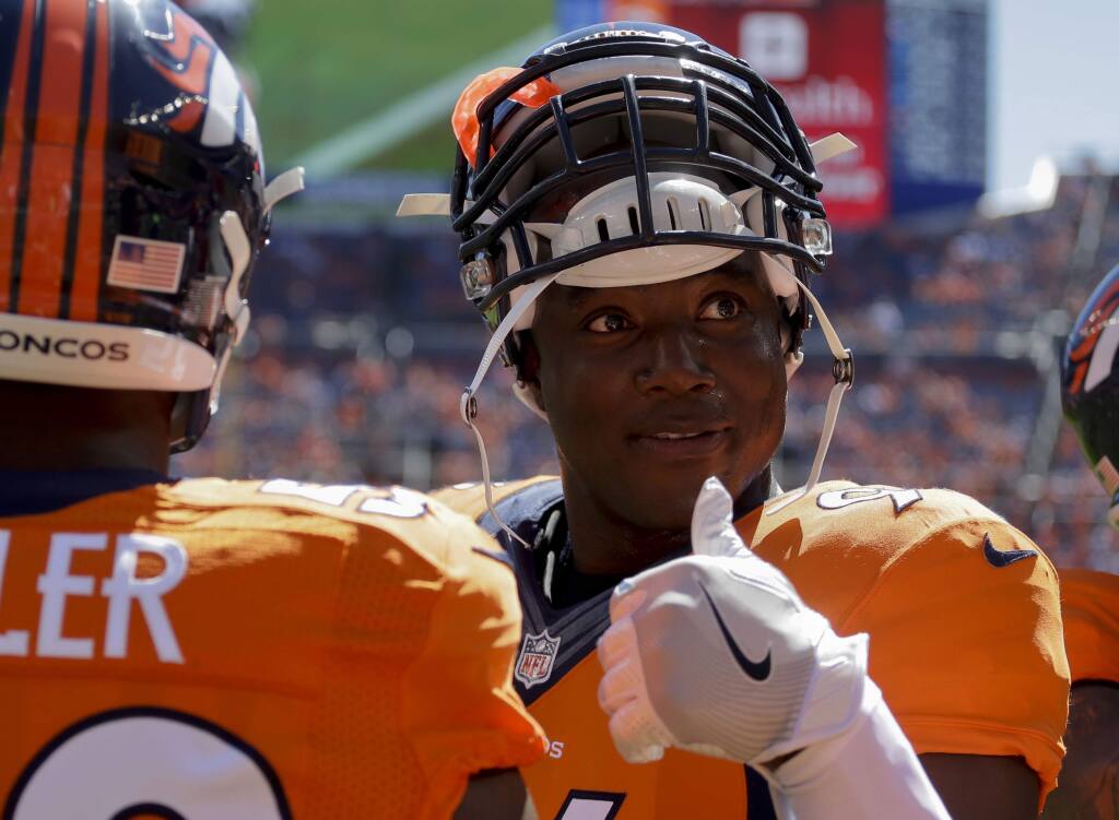 Denver Broncos outside linebacker DeMarcus Ware gestures during warms up before a NFL football game against the Indianapolis Colts, Sunday, Sept. 18, 2016, in Denver. (AP Photo/Jack Dempsey)
