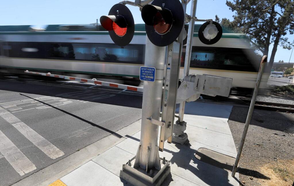A SMART train travels south, Tuesday, Sept. 10, 2018 at the crossing Of Golf Course drive in Rohnert Park. (Kent Porter / The Press Democrat) 2018