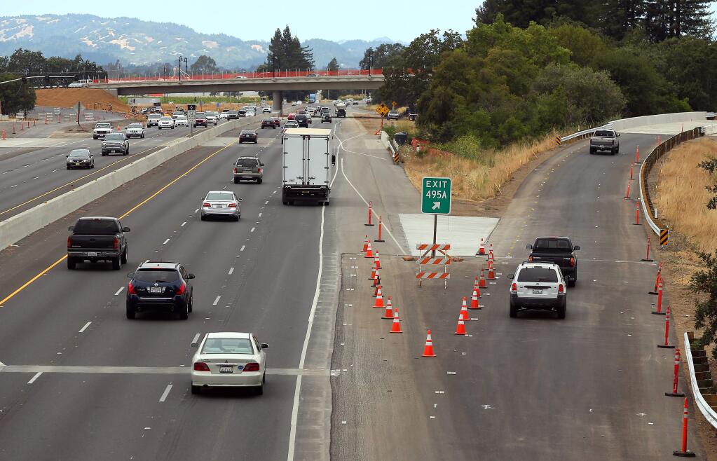 Vehicles exit on the newly opened northbound Highway 101 offramp at Airport Boulevard, in Santa Rosa on Friday, July 18, 2014. (Christopher Chung/ The Press Democrat)