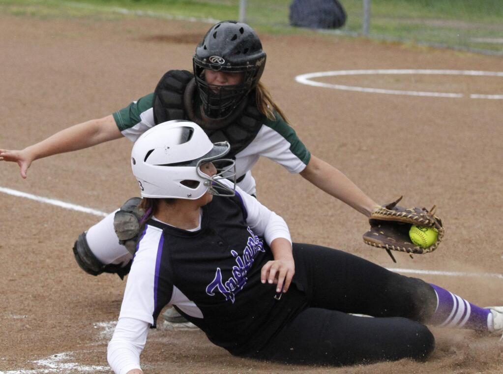 Bill Hoban/Index-TribuneSonoma catcher Lyndsey Lee tags a Petaluma runner out at home in thursday's game. Sonoma took an early lead, but the Trojand came back and won 13-3.