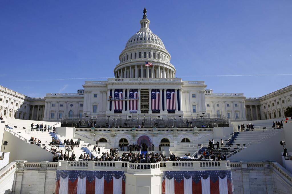 The U.S. Capitol frames the backdrop over the stage during a rehearsal for President-elect Donald Trump's swearing-in ceremony. Some two dozen House Democrats plan to boycott Trump's inauguration on Friday, casting the Republican businessman as a threat to democracy. (PATRICK SEMANSKY / Associated Press)