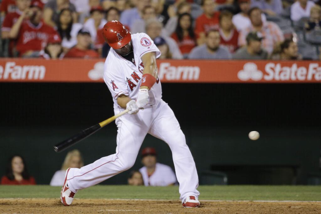 Los Angeles Angels' Albert Pujols hits a home run during the fifth inning of a baseball game against the Oakland Athletics Saturday, June 25, 2016, in Anaheim, Calif. (AP Photo/Gregory Bull)