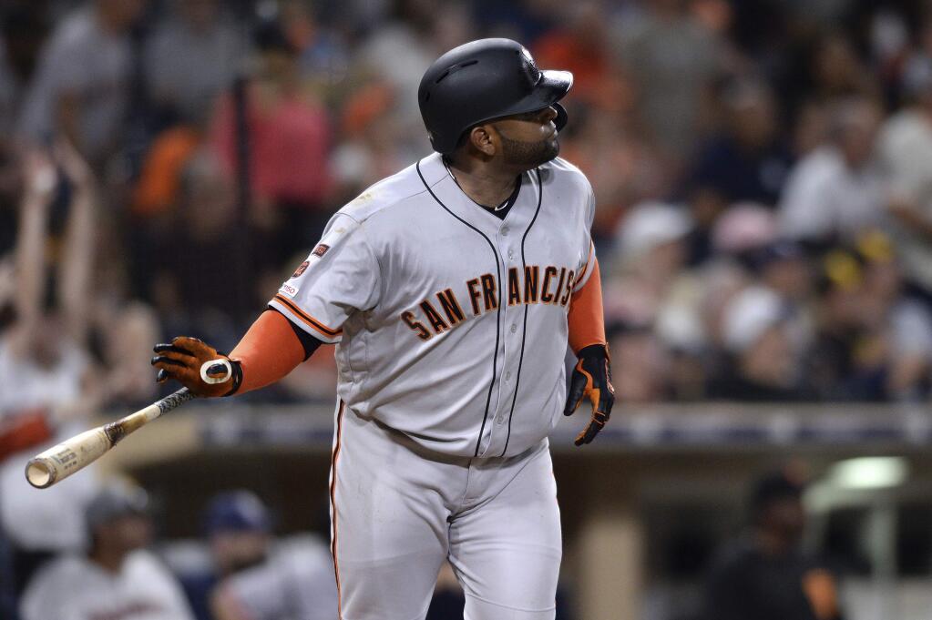 The San Francisco Giants' Pablo Sandoval watches his home run during the eleventh inning against the San Diego Padres Friday, July 26, 2019, in San Diego. (AP Photo/Orlando Ramirez)