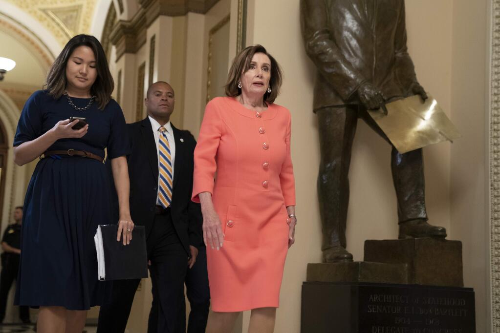 Speaker of the House Nancy Pelosi, D-Calif., walks to her office before voting on a resolution to take legal action against President Donald Trump's administration and potential witnesses, a response to those who defy subpoenas in Congress' Russia probe and other investigations, on Capitol Hill in Washington, Tuesday, June 11, 2019. The House resolution would authorize lawsuits against Attorney General William Barr and former White House counsel Don McGahn for defying subpoenas pertaining to special counsel Robert Mueller's report. (AP Photo/J. Scott Applewhite)