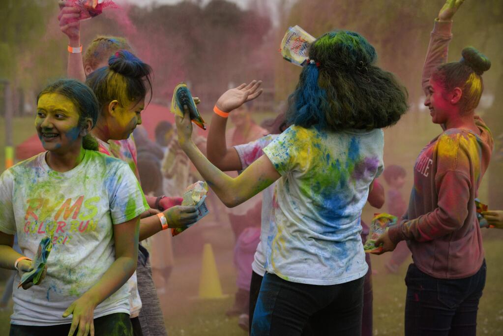Attendees during the tossing of the traditional colored powders, or gulal, during the North Bay Holi Festival, a Hindu festival of colors marking the arrival of spring, held Saturday at Lucchesi Park in Petaluma, California. March 10, 2018.(Photo: Erik Castro/for The Press Democrat)