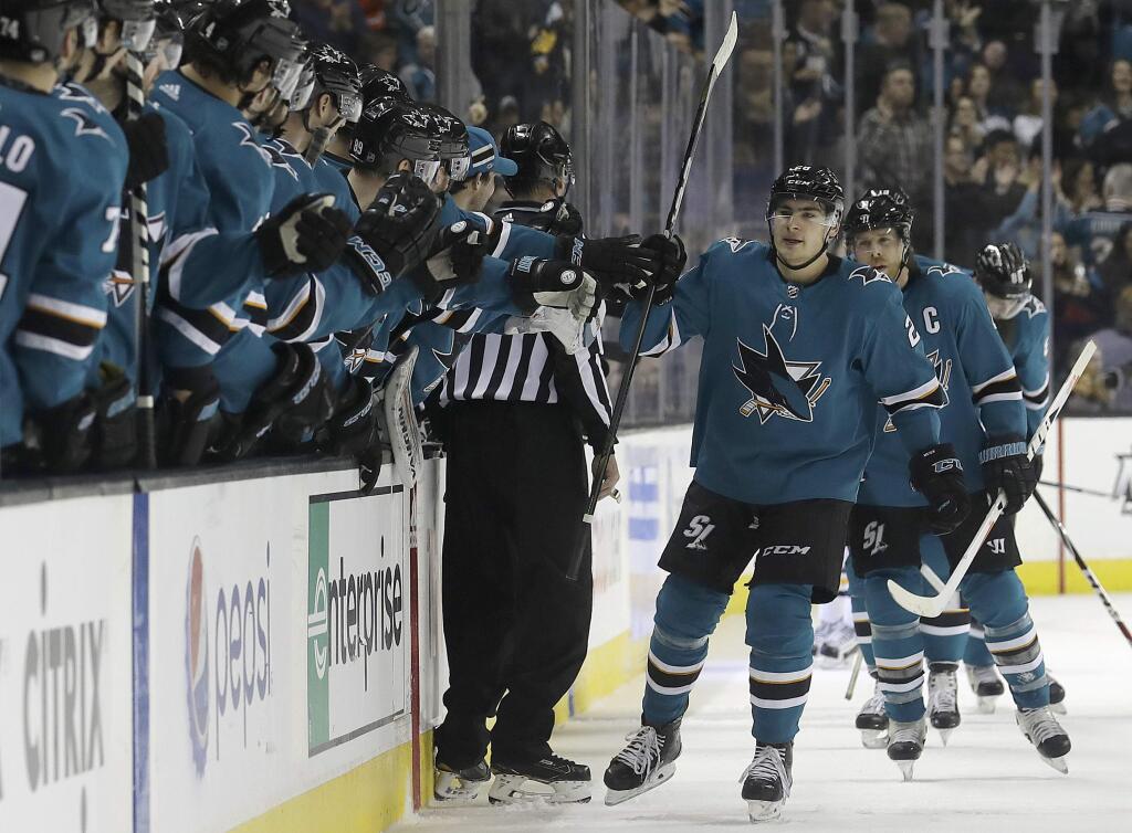 San Jose Sharks right wing Timo Meier, front right, from Switzerland, celebrates with teammates after scoring a goal against the Pittsburgh Penguins during the first period of an NHL hockey game in San Jose, Calif., Saturday, Jan. 20, 2018. (AP Photo/Jeff Chiu)