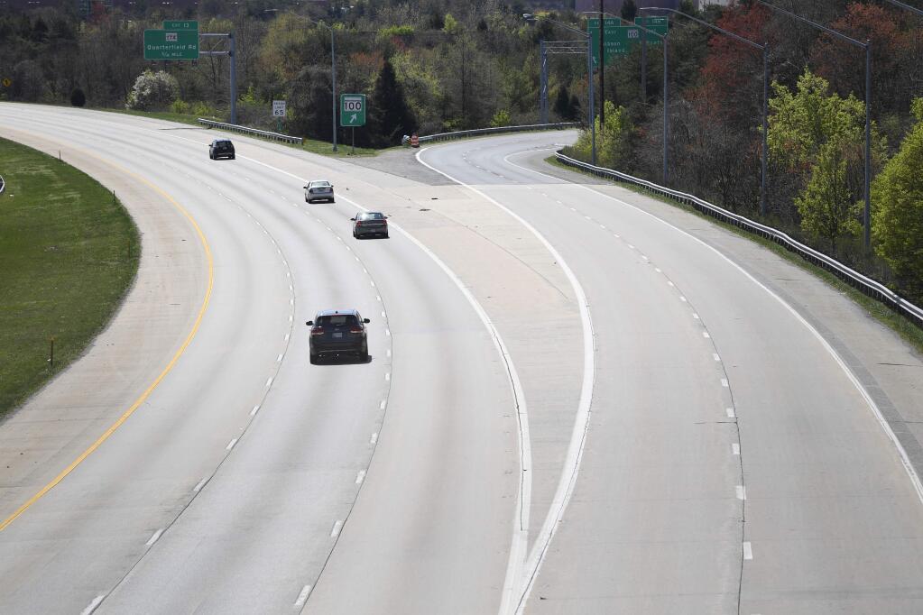 Drivers stay left to remain on Interstate 97 in light traffic in Glen Burnie, Md., Monday, April 6, 2020. (AP Photo/Susan Walsh)