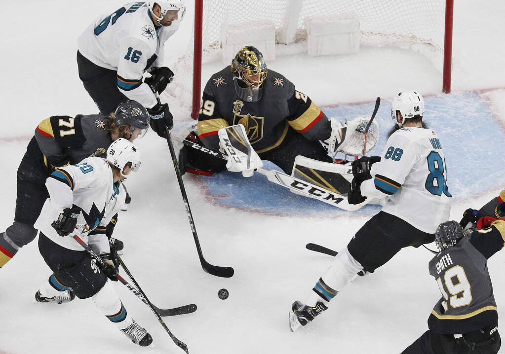Vegas Golden Knights goaltender Marc-Andre Fleury (29) blocks a shot by the San Jose Sharks during the second period of Game 1 of an NHL hockey second-round playoff series, Thursday, April 26, 2018, in Las Vegas. (AP Photo/John Locher)