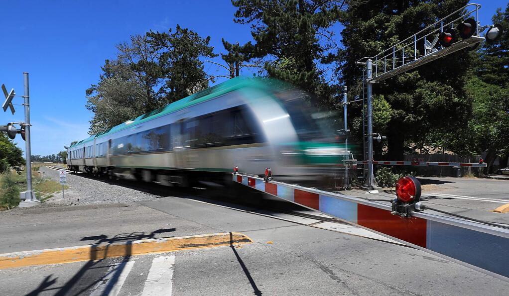A southbound SMART train rolls through the Scenic Avenue crossing, north of Rohnert Park, where a man who was lying on the tracks was struck and killed Tuesday, July 9, 2019. Photo taken Wednesday, July 10, 2019. (KENT PORTER/ PD)