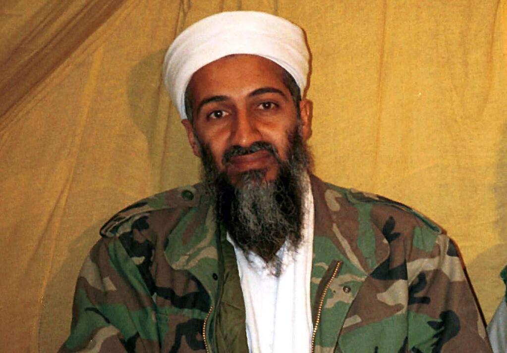 FILE - This undated file photo shows al Qaida leader Osama bin Laden in Afghanistan. U.S. intelligence officials have released more than 100 documents seized in the raid on Osama bin Ladenís compound, including a loving letter to his wife and a job application for his terrorist network. The Office of the Director of National Intelligence says the papers were taken in the Navy SEALs raid that killed bin Laden in Pakistan in 2011. (AP Photo, File)