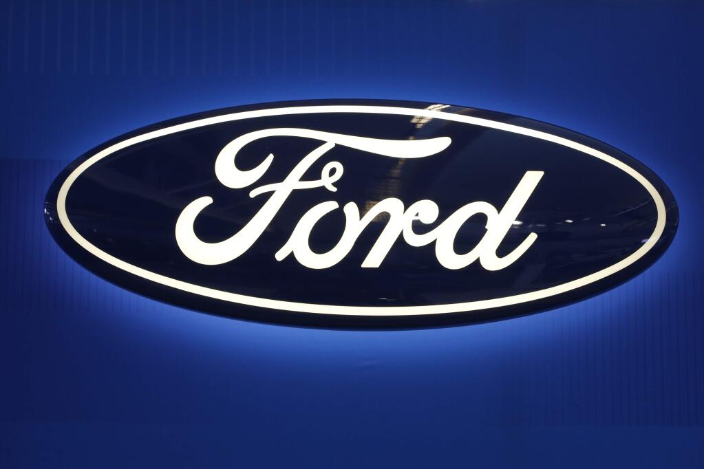 FILE - This Feb. 11, 2016, file photo shows the Ford logo on display at the Pittsburgh International Auto Show in Pittsburgh. Ford Motor will spend $1 billion to take over a robotics startup to acquire more of the expertise needed to reach its ambitious goal of having a fully driverless vehicle on the road by 2021. The big bet announced Friday, Feb. 10, 2017, comes just a few months after the Pittsburgh startup, Argo AI, was created by two alumni of Carnegie Mellon University's robotics program, Bryan Salesky and Peter Rander.(AP Photo/Gene J. Puskar, File)