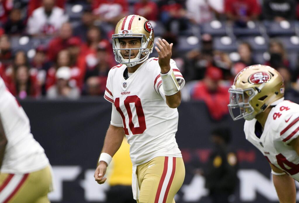 San Francisco 49ers quarterback Jimmy Garoppolo signals during a game against the Houston Texans, Sunday, Dec. 10, 2017, in Houston. (AP Photo/Eric Christian Smith)