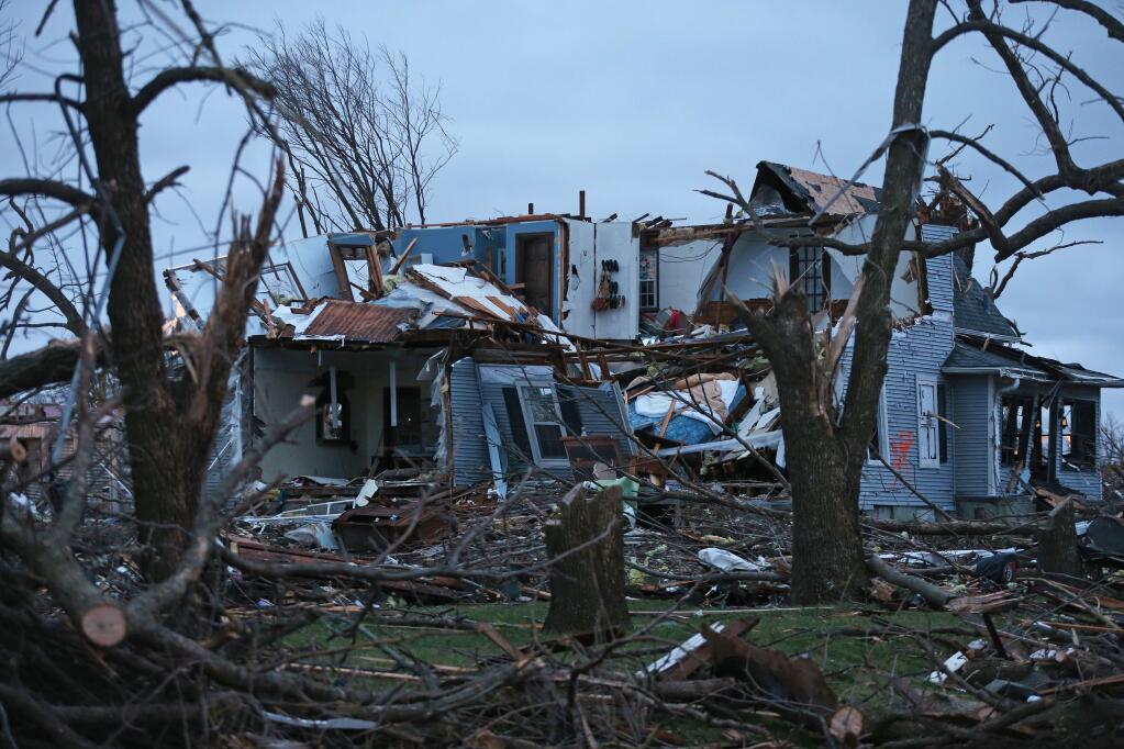 A house is destroyed after a late night tornado passed through the area, Friday, April 10, 2015 in Fairdale, Ill. The National Weather Service says at least two tornadoes churned through six north-central Illinois counties. (AP Photo/Chicago Tribune, John J. Kim) MANDATORY CREDIT CHICAGO TRIBUNE; CHICAGO SUN-TIMES OUT; DAILY HERALD OUT; NORTHWEST HERALD OUT; THE HERALD-NEWS OUT; DAILY CHRONICLE OUT; THE TIMES OF NORTHWEST INDIANA OUT; TV OUT; MAGS OUT; NO SALES