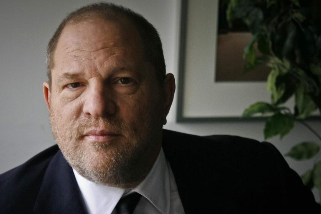 FILE - In this Nov. 23, 2011 file photo, film producer Harvey Weinstein poses for a photo in New York. (AP Photo/John Carucci, File)