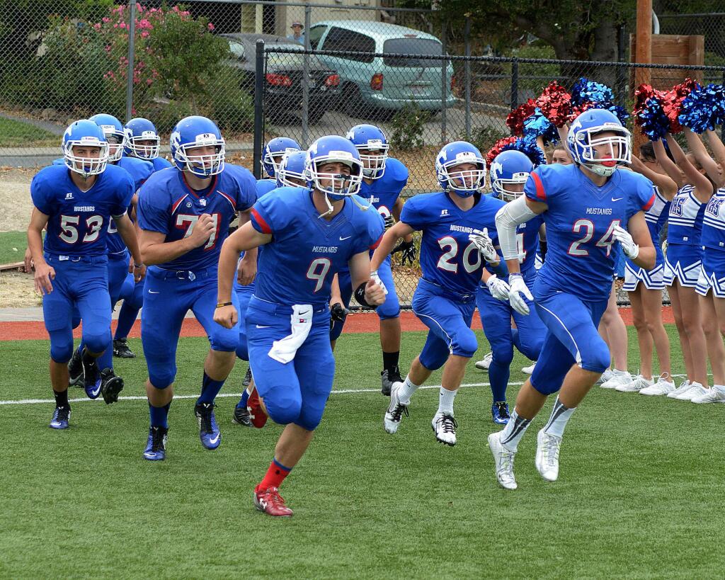 St. Vincent de Paul's players take the field before their football game against San Rafael at Saint Vincent de Paul High School in Petaluma on Saturday, September 13, 2015. (SUMNER FOWLER/FOR THE ARGUS-COURIER)
