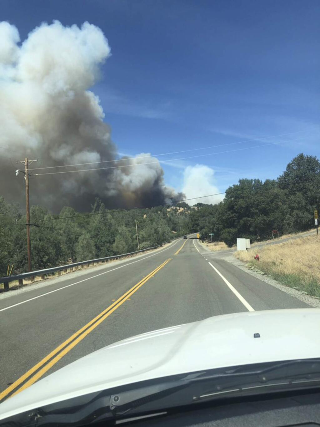This photo provided by Cal Fire shows the Mountain fire burning Thursday, Aug. 22, 2019, near Redding, Calif. (Cal Fire via AP)