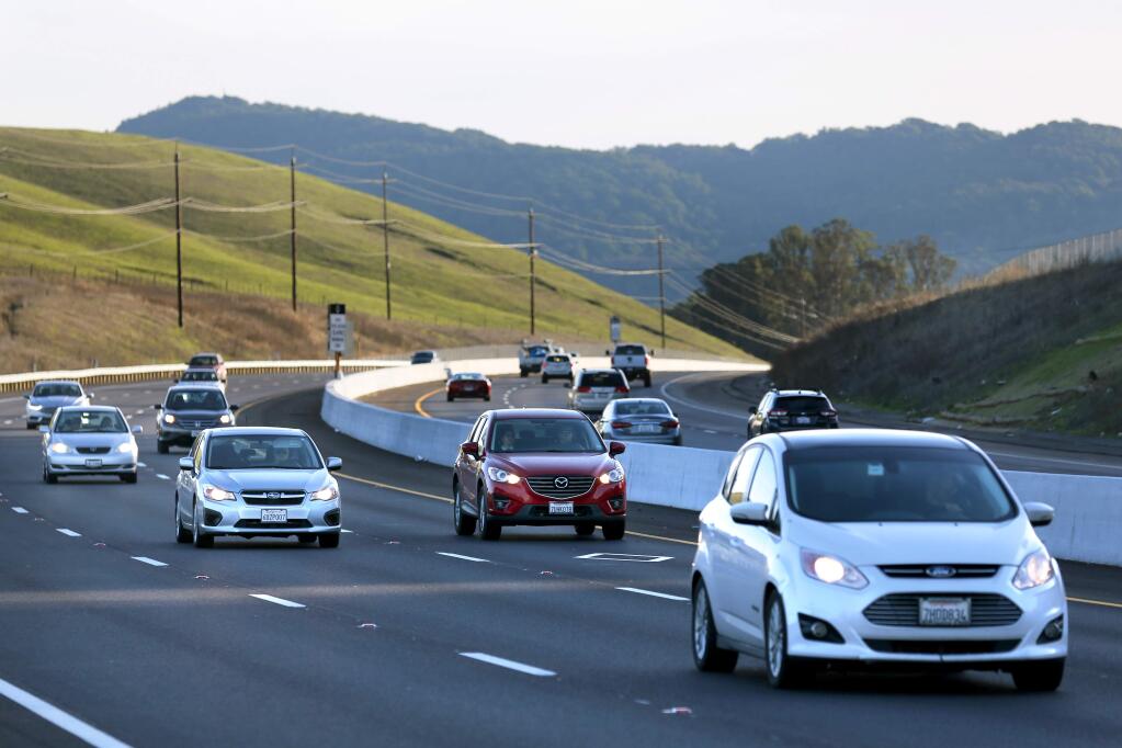 Cars travel in all six lanes of Hwy 101 just north of the Sonoma County line in Petaluma, California on Monday, December 16, 2019. (BETH SCHLANKER/The Press Democrat)