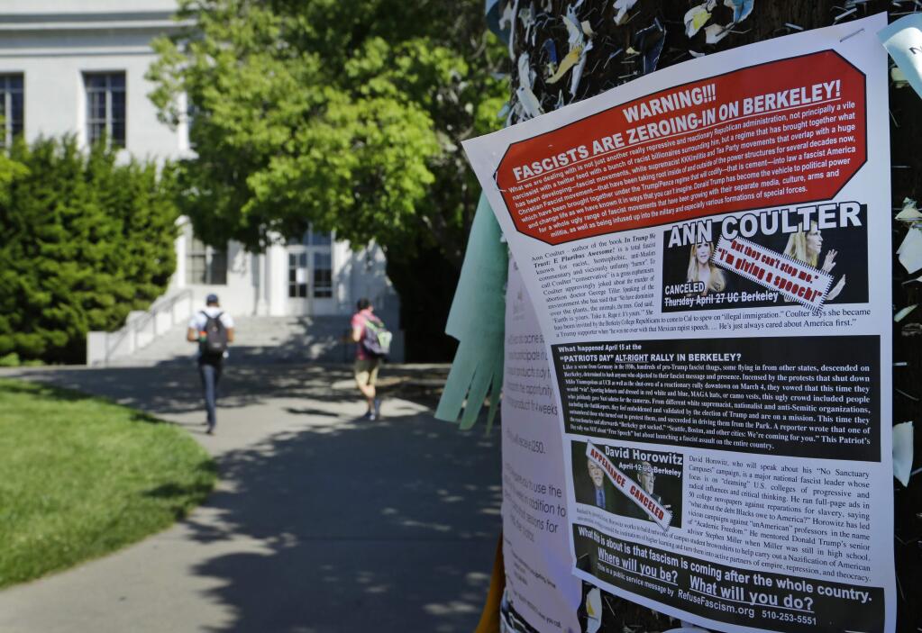 A leaflet is seen stapled to a message board near Sproul Hall on the University of California at Berkeley on Friday, April 21, 2017, in Berkeley, Calif. The campus is bracing for a showdown next week, when the conservative provocateur Ann Coulter has vowed to speak in defiance of the university's wishes. Officials, police and the campus Republicans who invited Coulter, say there are valid concerns for violence in what is being called an ongoing 'Battle of Berkeley.' (AP Photo/Ben Margot)