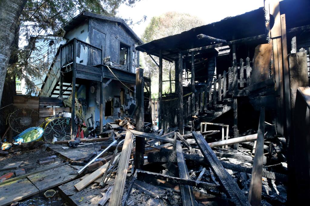 Fifth Street residences near the corner of Church Street were significantly damaged during a fire late Saturday night. Photo taken in Guerneville, on Sunday, June 30, 2019. The home at 16442 Fifth St. was completely burned, while the residence at 16440 Fifth St. sustained fire damage mostly to the second story and the rear. Also damaged was small building or garage that was under construction on the property. (BETH SCHLANKER/ The Press Democrat)
