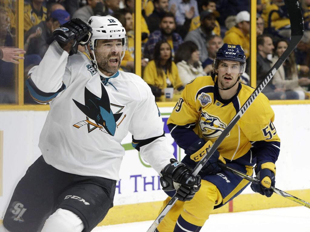 San Jose Sharks left wing Patrick Marleau (12) celebrates after scoring a goal against the Nashville Predators during the first period in Game 3 of an NHL hockey Stanley Cup Western Conference semifinal playoff series Tuesday, May 3, 2016, in Nashville, Tenn. At right is Predators defenseman Roman Josi (59), of Switzerland. (AP Photo/Mark Humphrey)